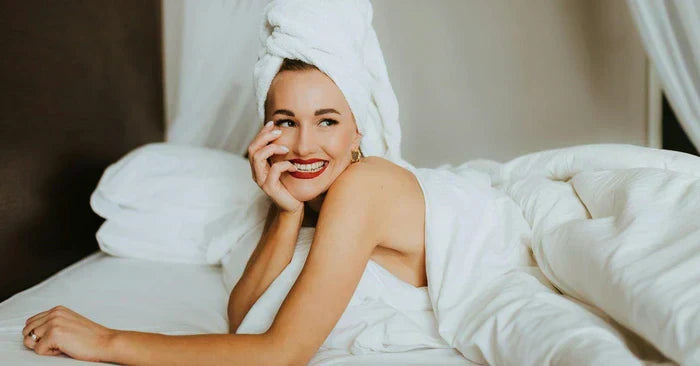 Sexy woman with a hair wrap in bed