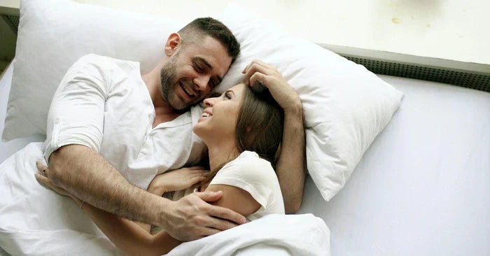 Happy couple in bed